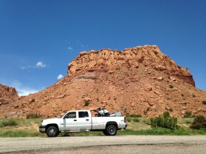 my truck and red cliffs near Ghost Ranch, NM